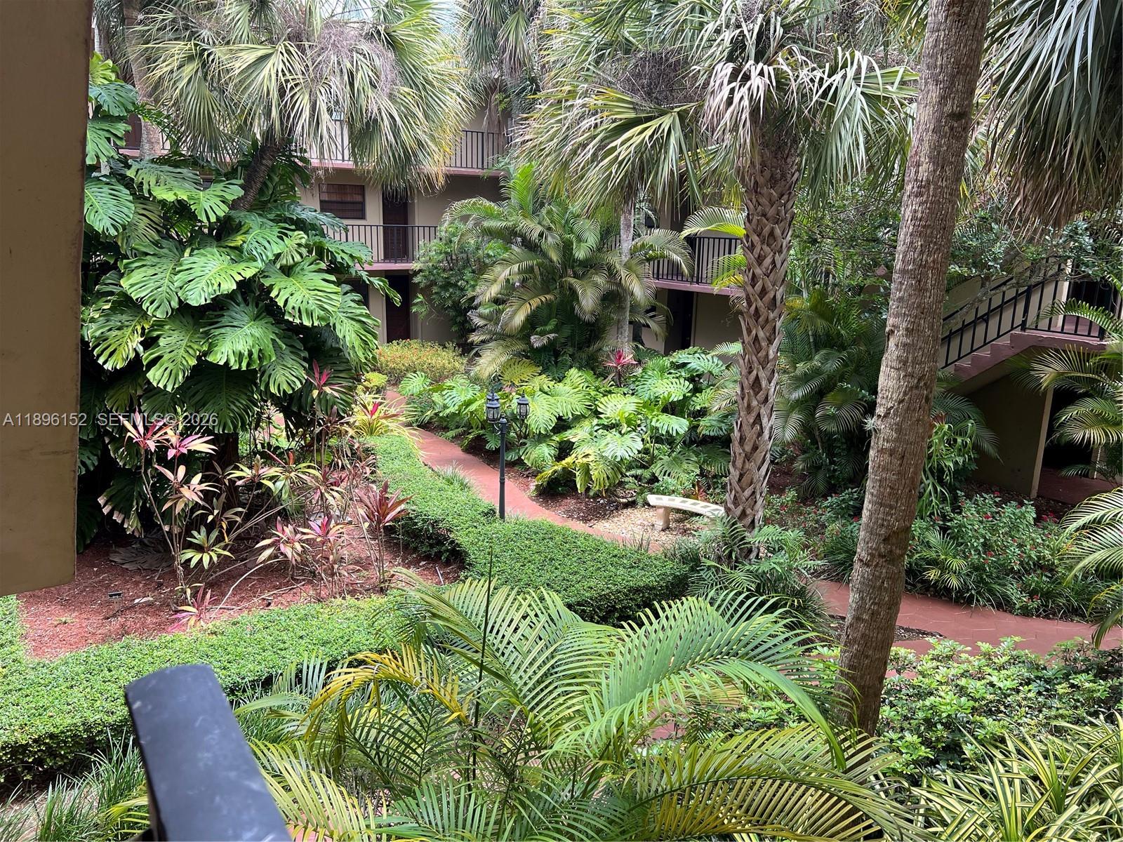 10855 Southwest 112th Avenue, Unit 215 Miami, FL 33176 - Photo 20 of 45 a view of a garden with a fountain