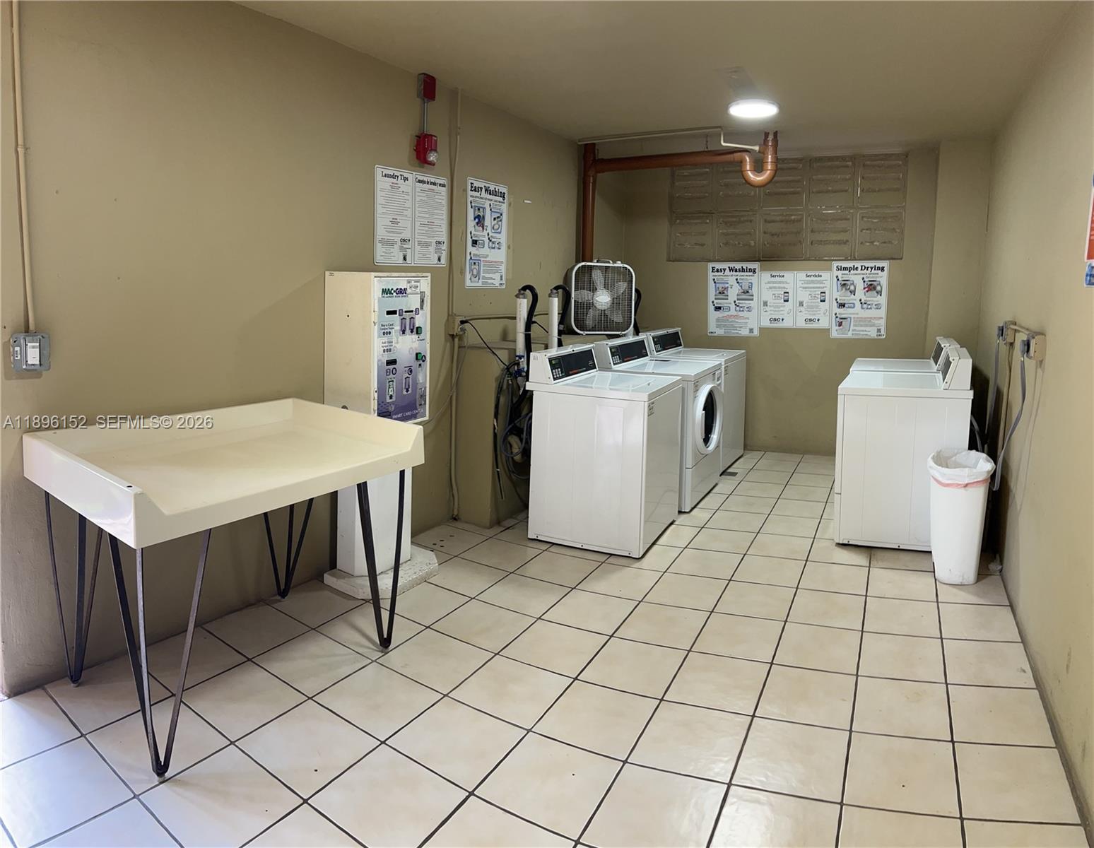 10855 Southwest 112th Avenue, Unit 215 Miami, FL 33176 - Photo 22 of 45 a room with a washing machine and a sink