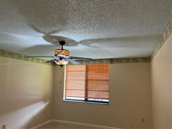 a view of a livingroom with a kitchen