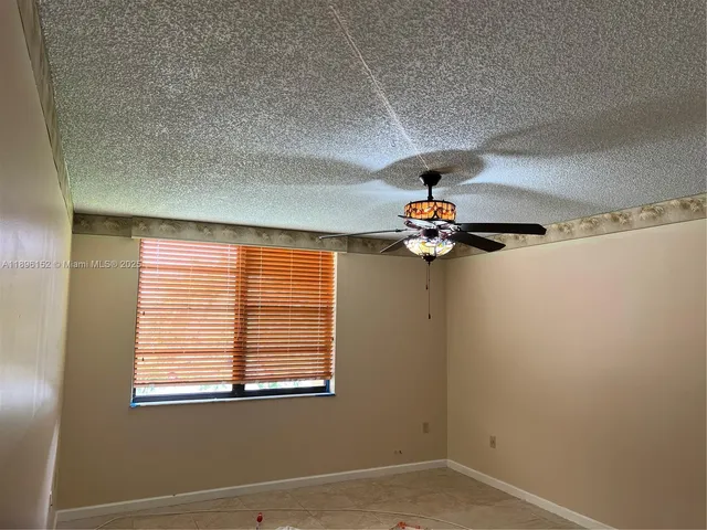 a view of a livingroom with a kitchen