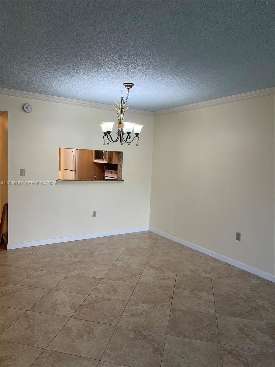 10855 Southwest 112th Avenue, Unit 215 Miami, FL 33176 - Photo 30 of 45 a view of a livingroom with a kitchen