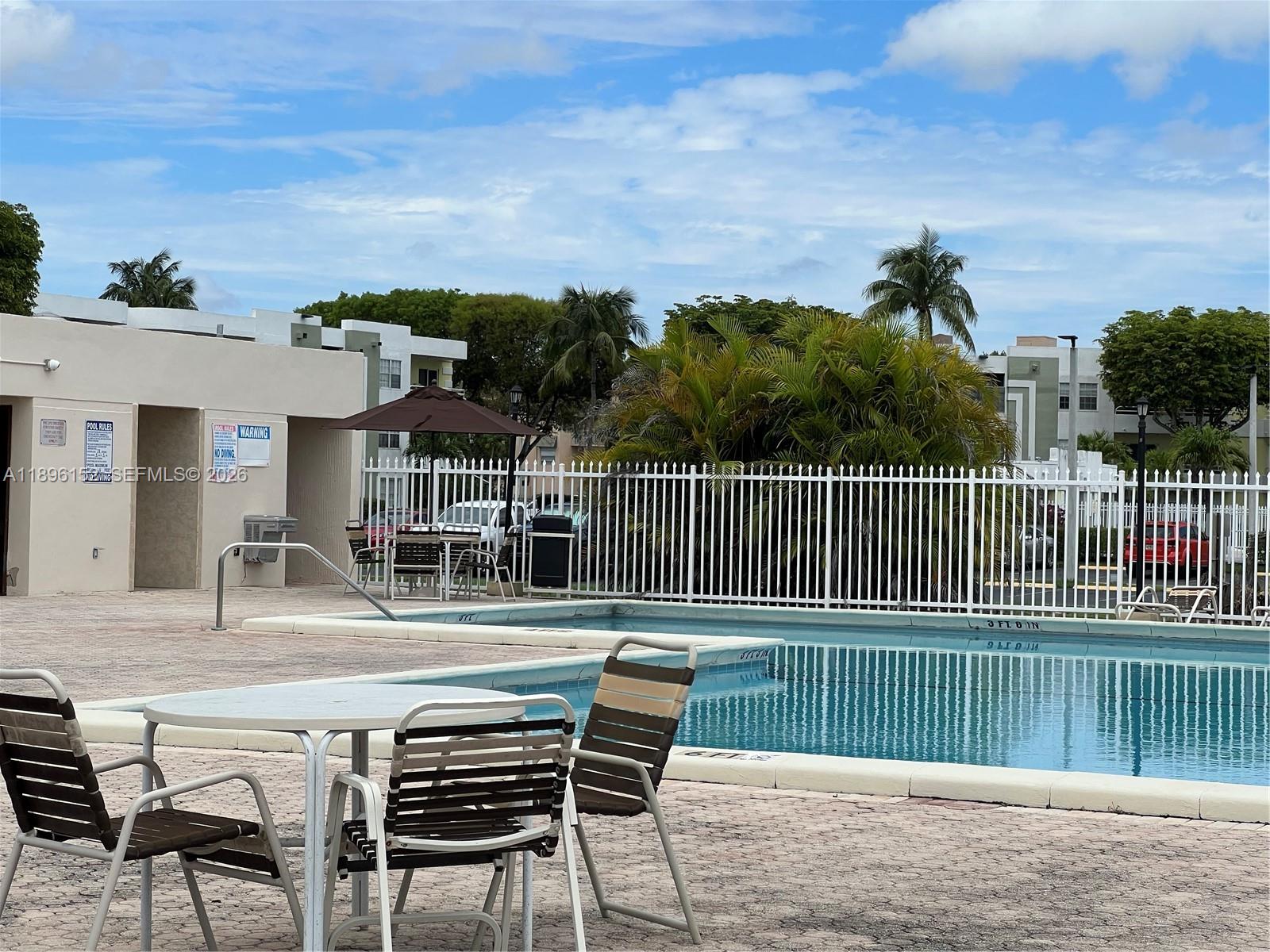 10855 Southwest 112th Avenue, Unit 215 Miami, FL 33176 - Photo 34 of 45 a view of house with deck and outdoor seating