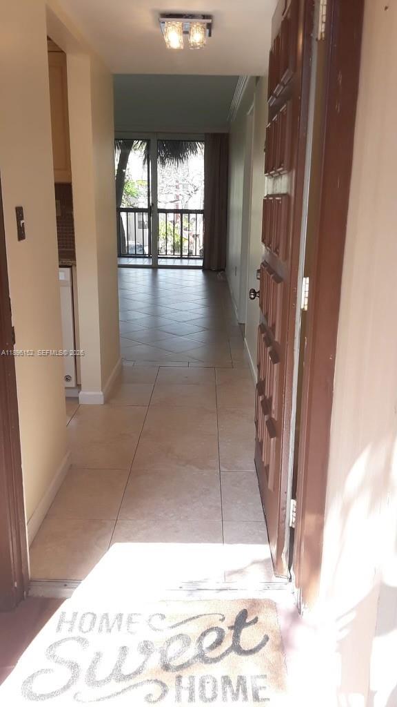 10855 Southwest 112th Avenue, Unit 215 Miami, FL 33176 - Photo 44 of 45 a view of entryway and hall with wooden floor