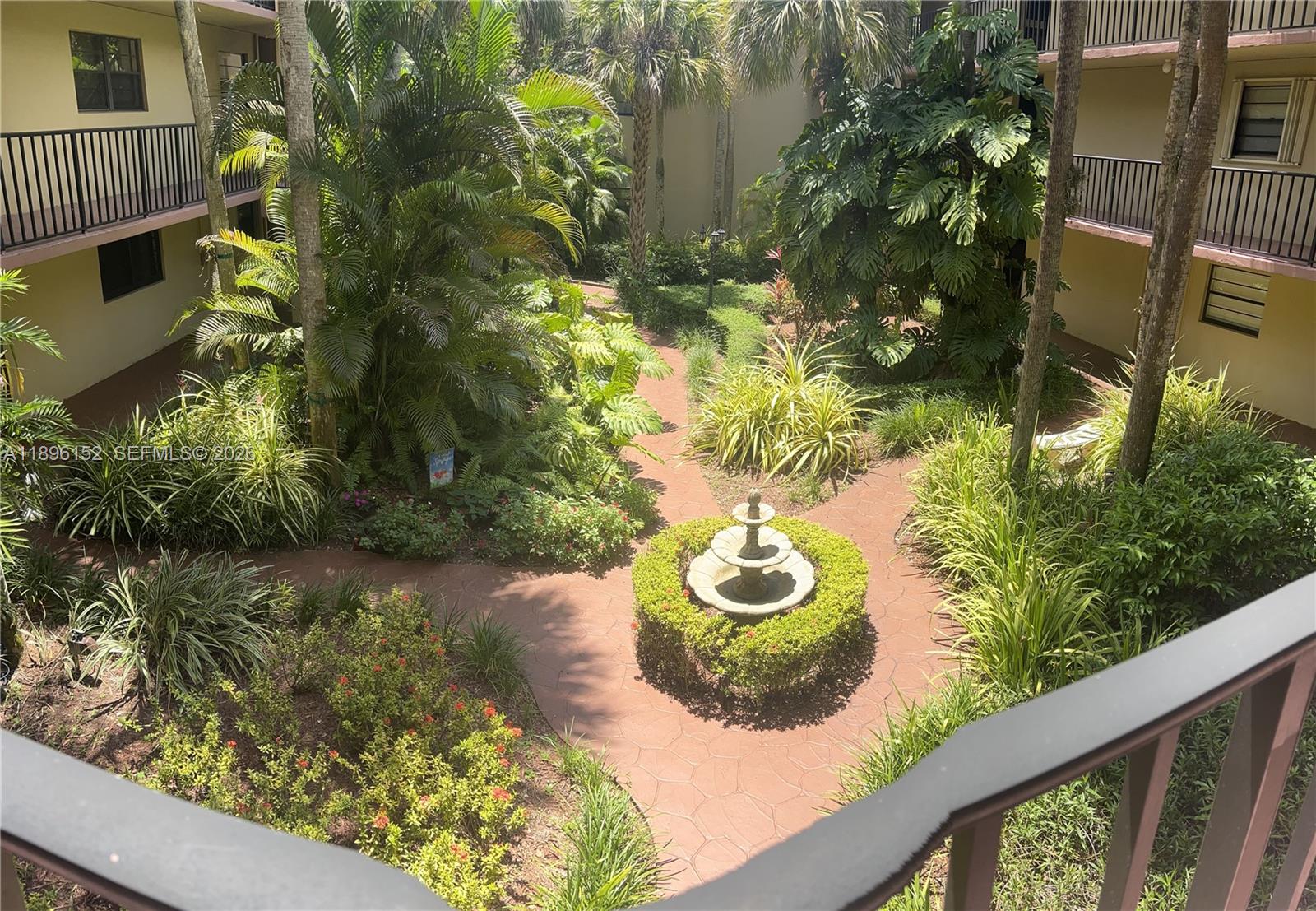 10855 Southwest 112th Avenue, Unit 215 Miami, FL 33176 - Photo 10 of 45 a view of a garden from a balcony