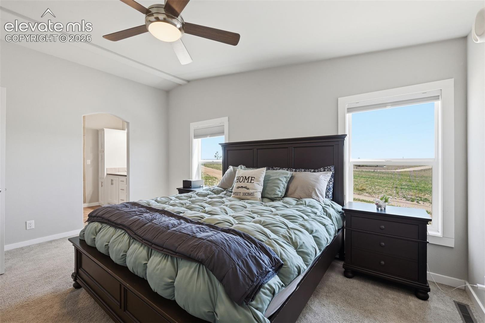 23335 Sanborn Road Calhan, CO 80808 - Photo 13 of 28 Primary suite with peaceful prairie views and walk-in closet