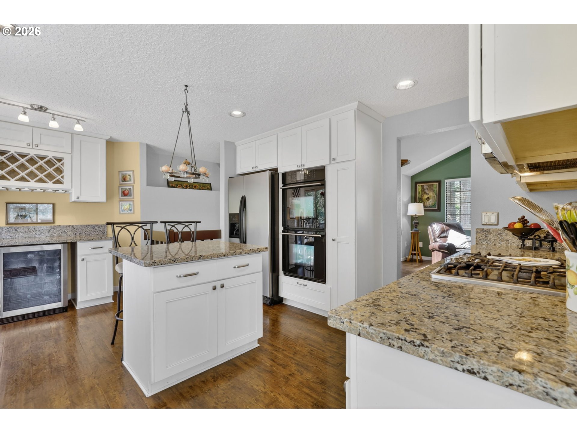 21155 Southeast Foster Road Damascus, OR 97089 - Photo 16 of 48 a kitchen with stainless steel appliances granite countertop a sink stove and refrigerator