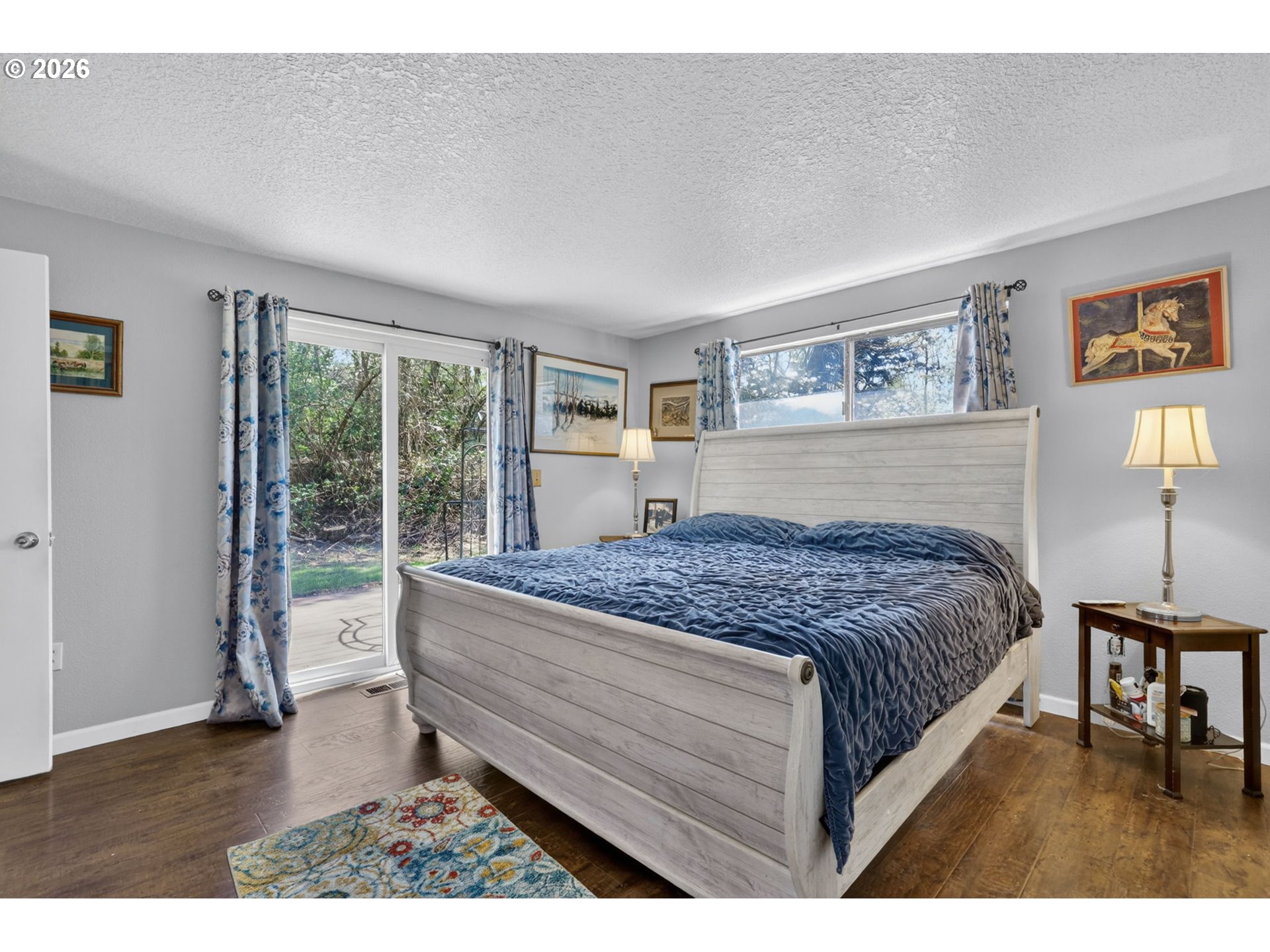 21155 Southeast Foster Road Damascus, OR 97089 - Photo 20 of 48 a bedroom with a large bed and a window