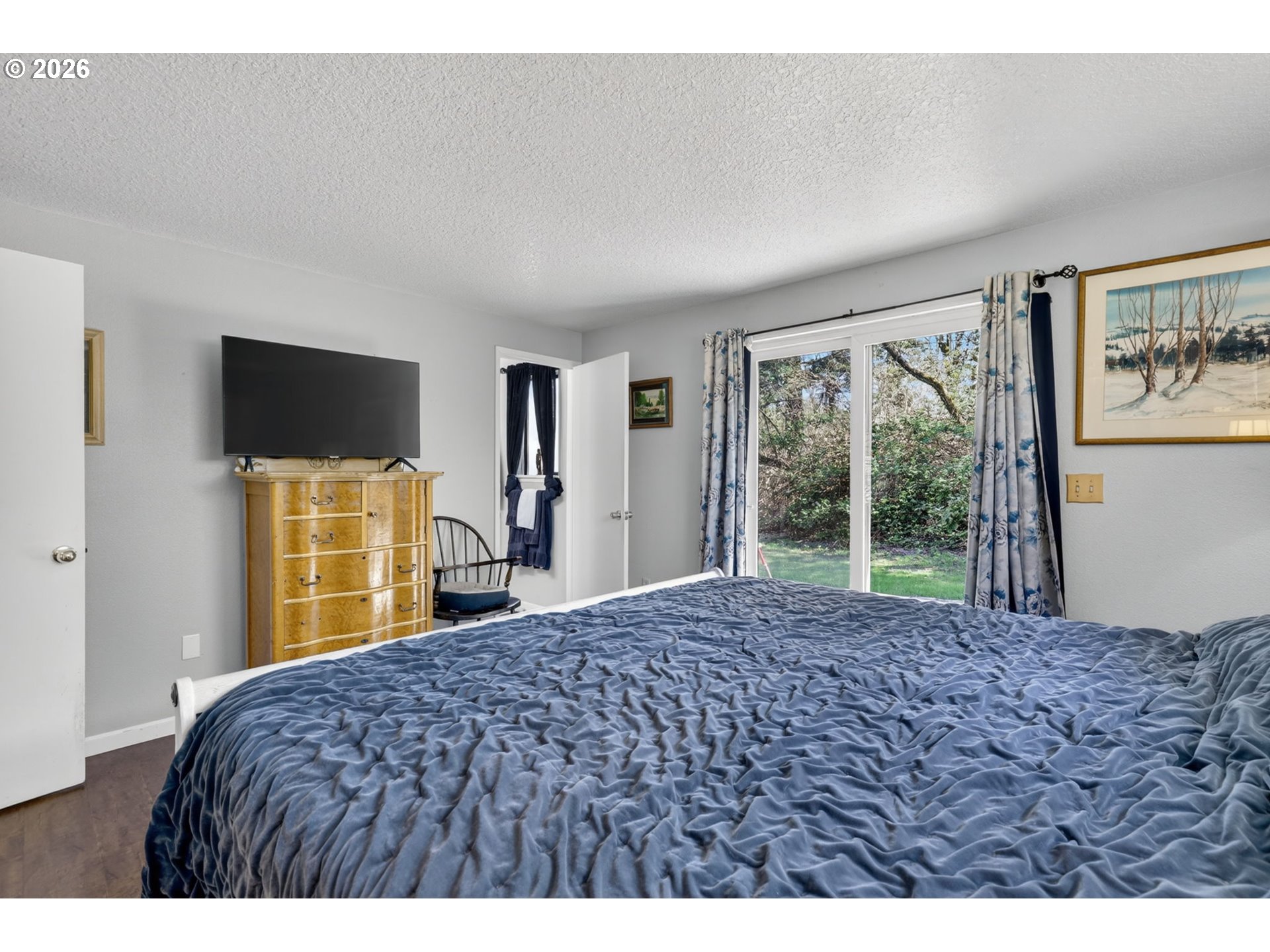 21155 Southeast Foster Road Damascus, OR 97089 - Photo 22 of 48 a bedroom with a bed and a flat screen tv