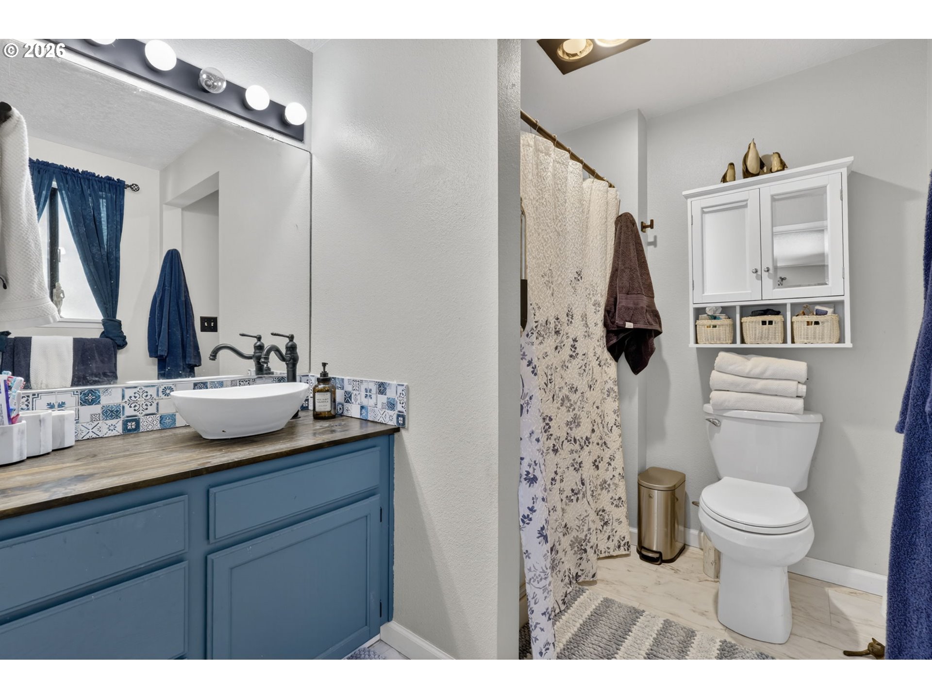 21155 Southeast Foster Road Damascus, OR 97089 - Photo 23 of 48 a bathroom with a sink toilet and shower