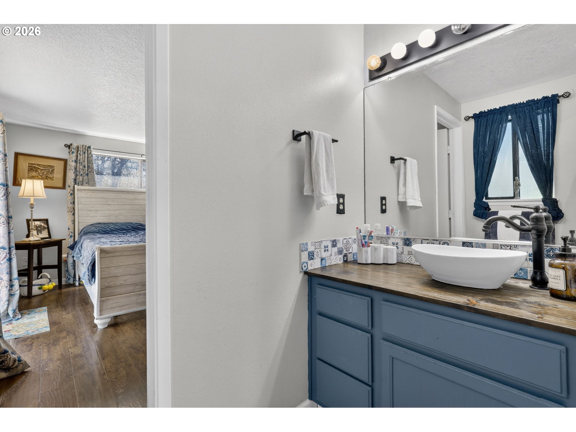 21155 Southeast Foster Road Damascus, OR 97089 - Photo 24 of 48 a bathroom with a granite countertop sink and a mirror