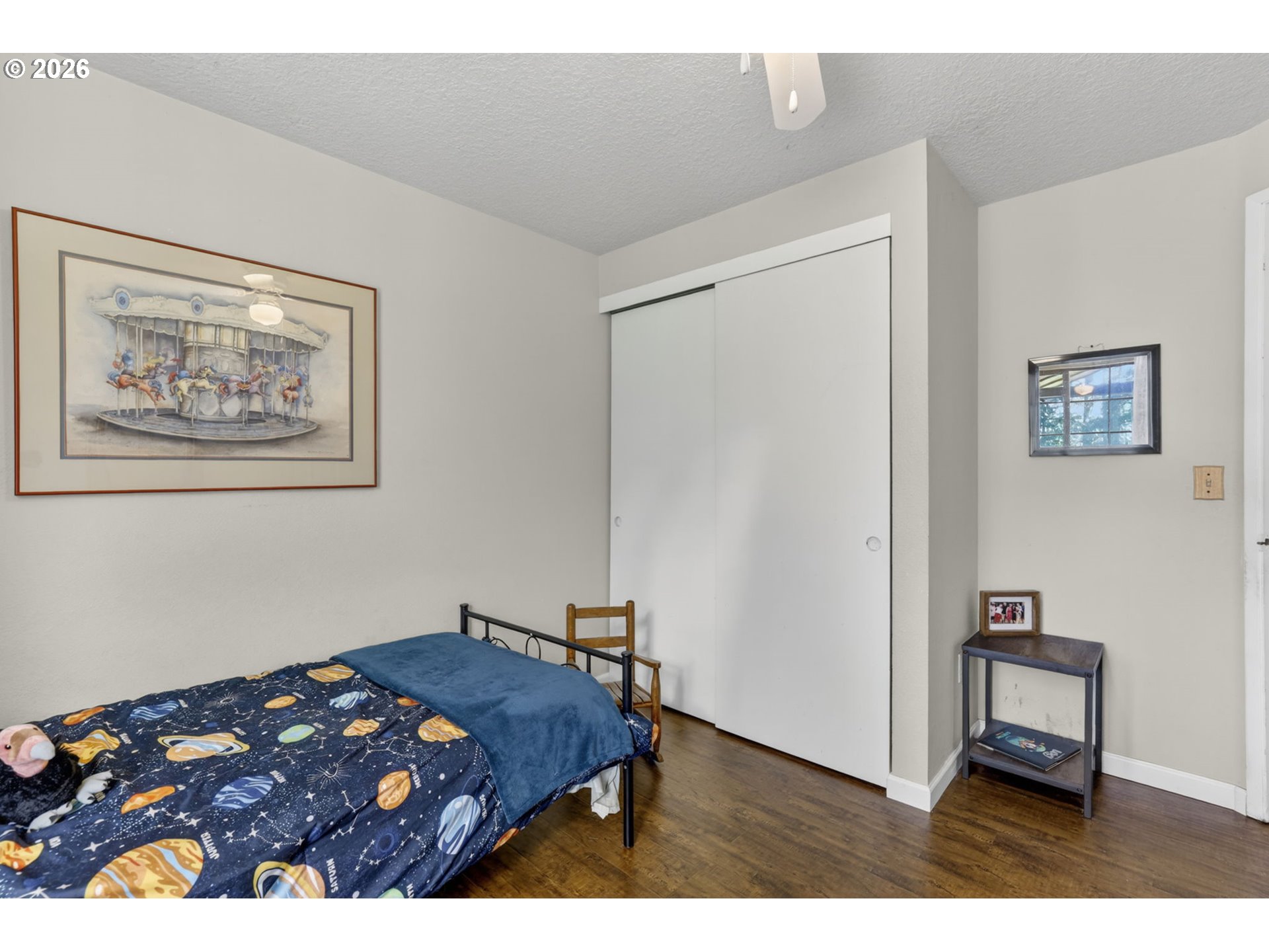 21155 Southeast Foster Road Damascus, OR 97089 - Photo 27 of 48 a bedroom with a bed and a painting on the wall