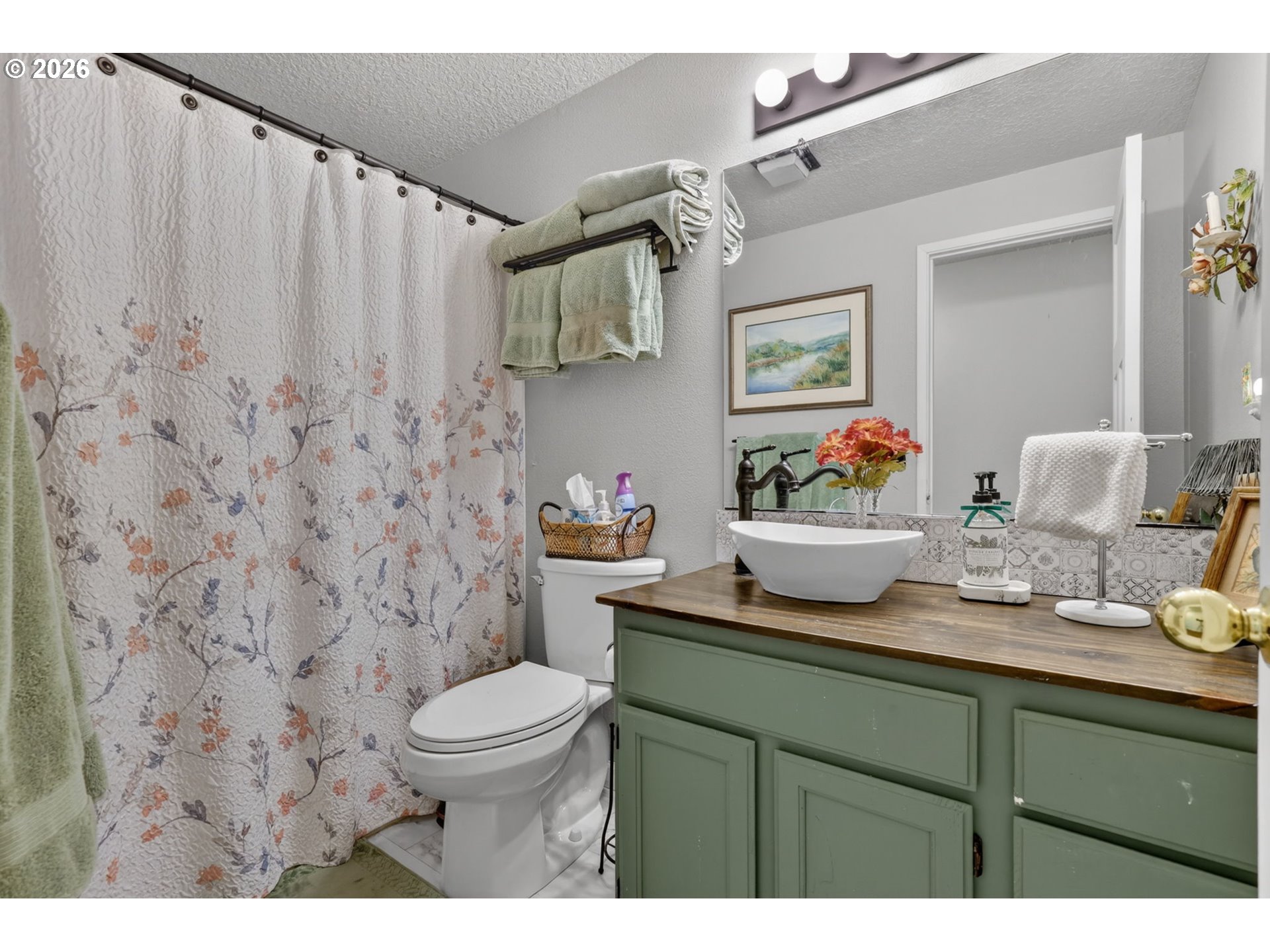 21155 Southeast Foster Road Damascus, OR 97089 - Photo 28 of 48 a bathroom with a sink a toilet and a mirror