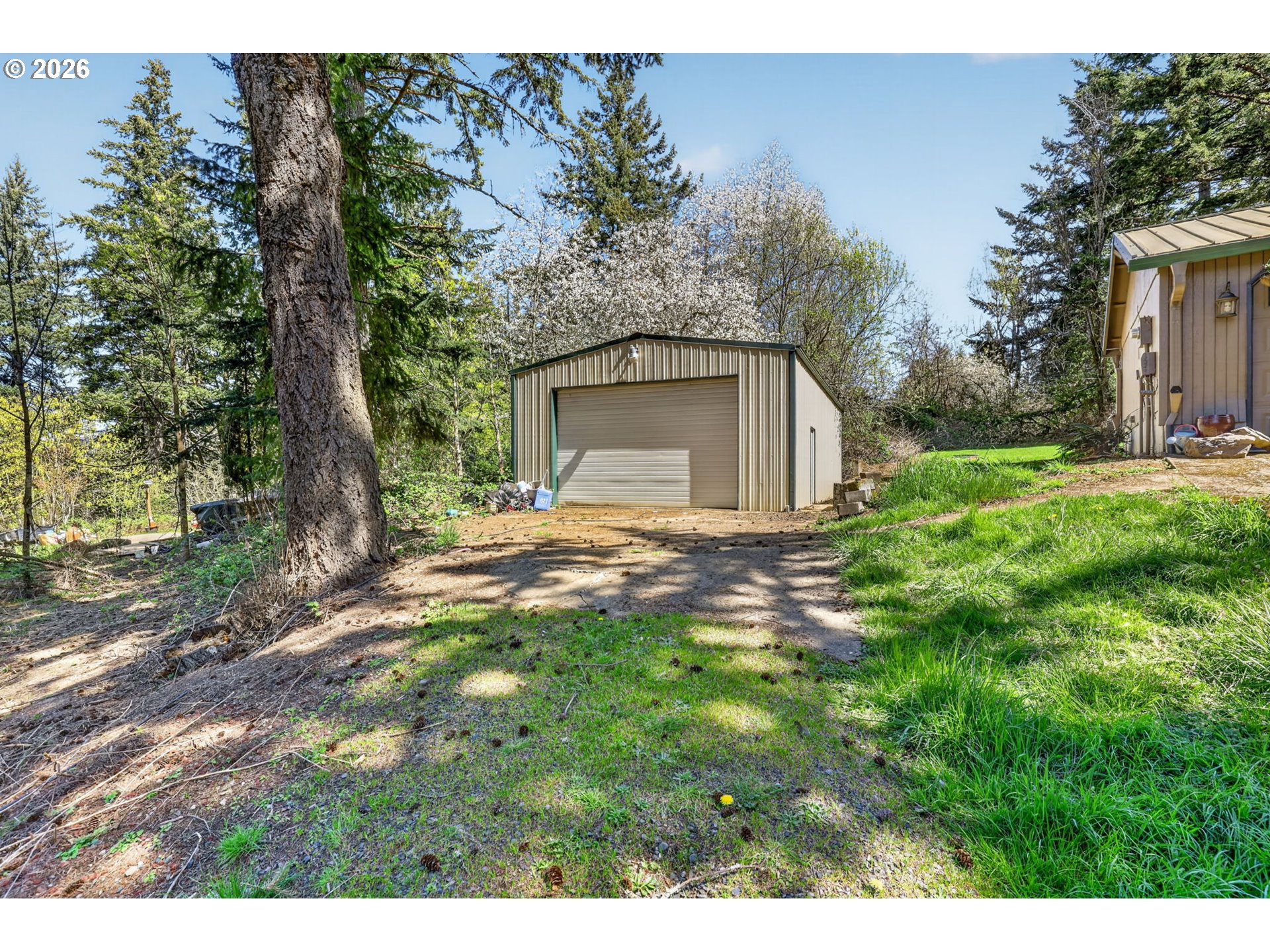 21155 Southeast Foster Road Damascus, OR 97089 - Photo 41 of 48 a view of a yard with small trees