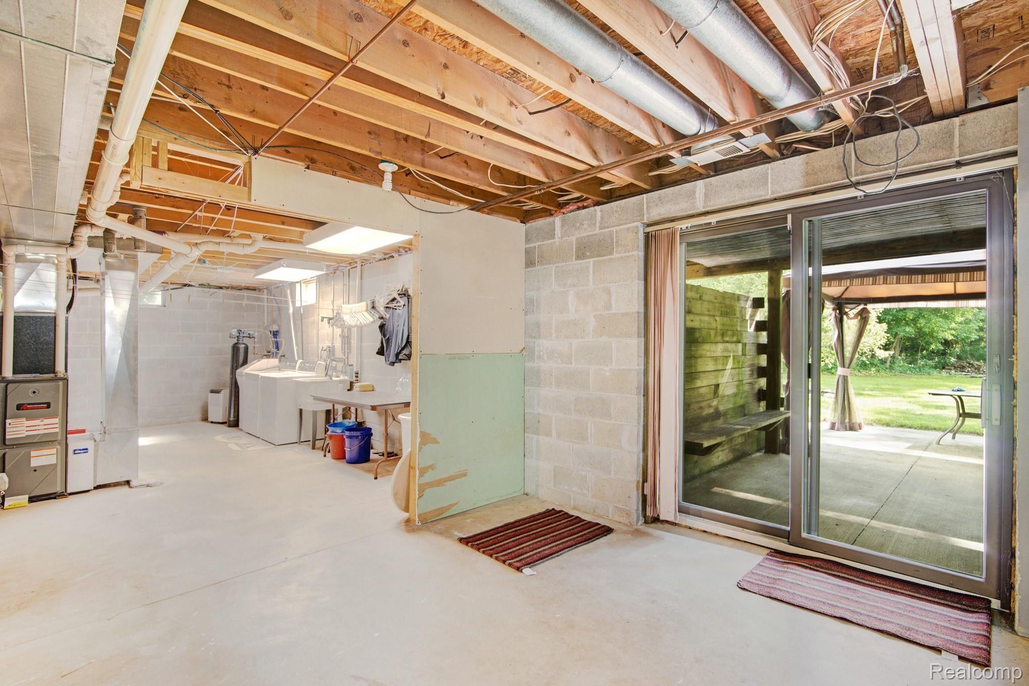 6671 North Fowlerville Road Fowlerville, MI 48836 - Photo 21 of 27 Walk out basement to patio area