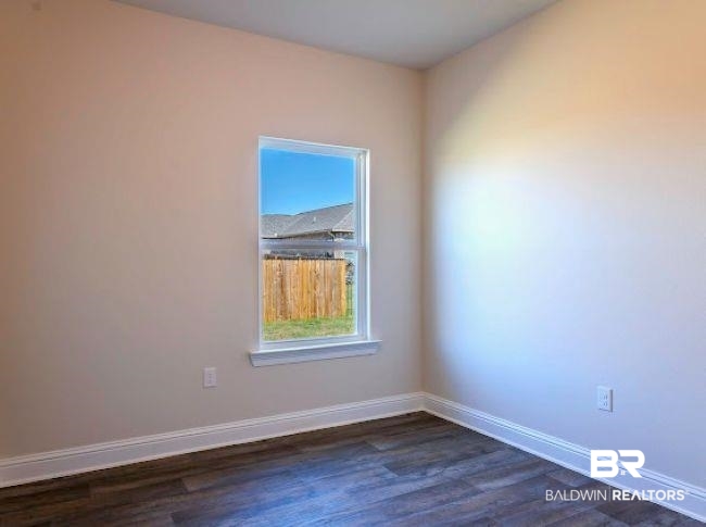 16810 Rocher Court Foley, AL 36535 - Photo 19 of 24 Neutral-toned walls complement wood-finish flooring in this room