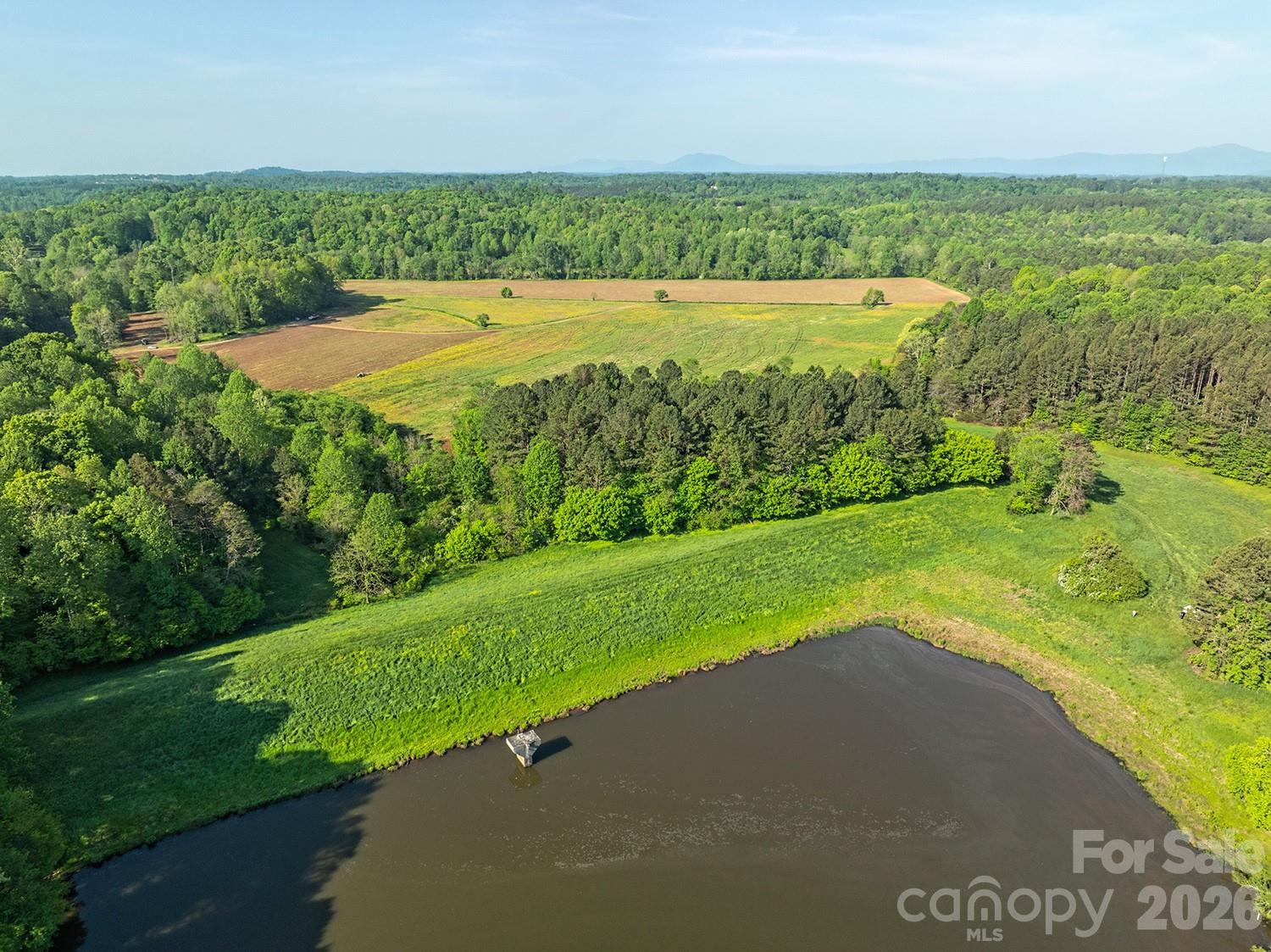 5555 Groves Road Union Mills, NC 28167 - Photo 12 of 26 a view of a swimming pool and a yard