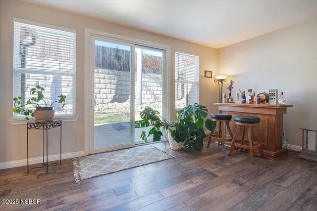 a kitchen with a sink a counter space and cabinets