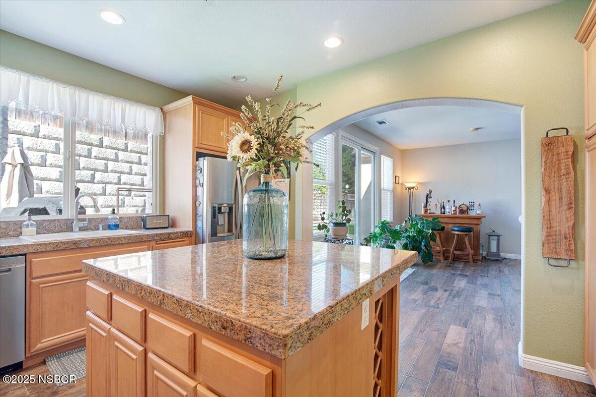 561 Andromeda Drive Lompoc, CA 93436 - Photo 22 of 54 a kitchen with counter top space and wooden floor