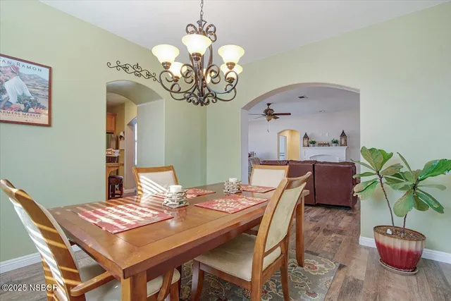 a bedroom with a bed a mirror and window