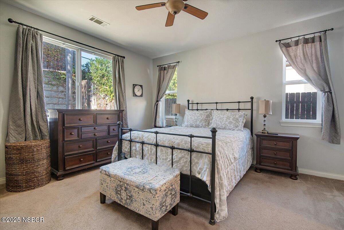 561 Andromeda Drive Lompoc, CA 93436 - Photo 26 of 54 a bedroom with a bed closet and flat tv screen