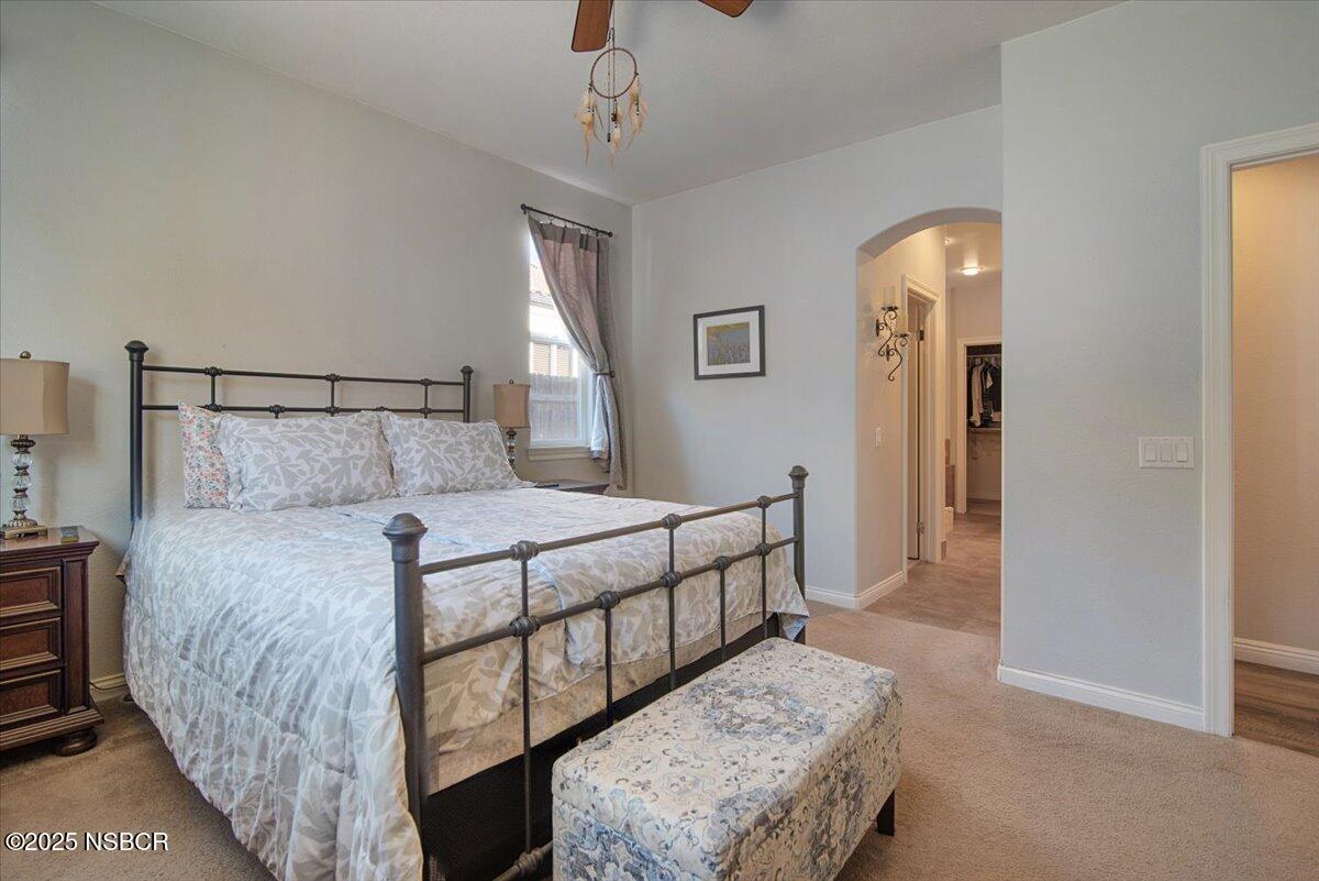 561 Andromeda Drive Lompoc, CA 93436 - Photo 28 of 54 a bedroom with a bed a mirror and window