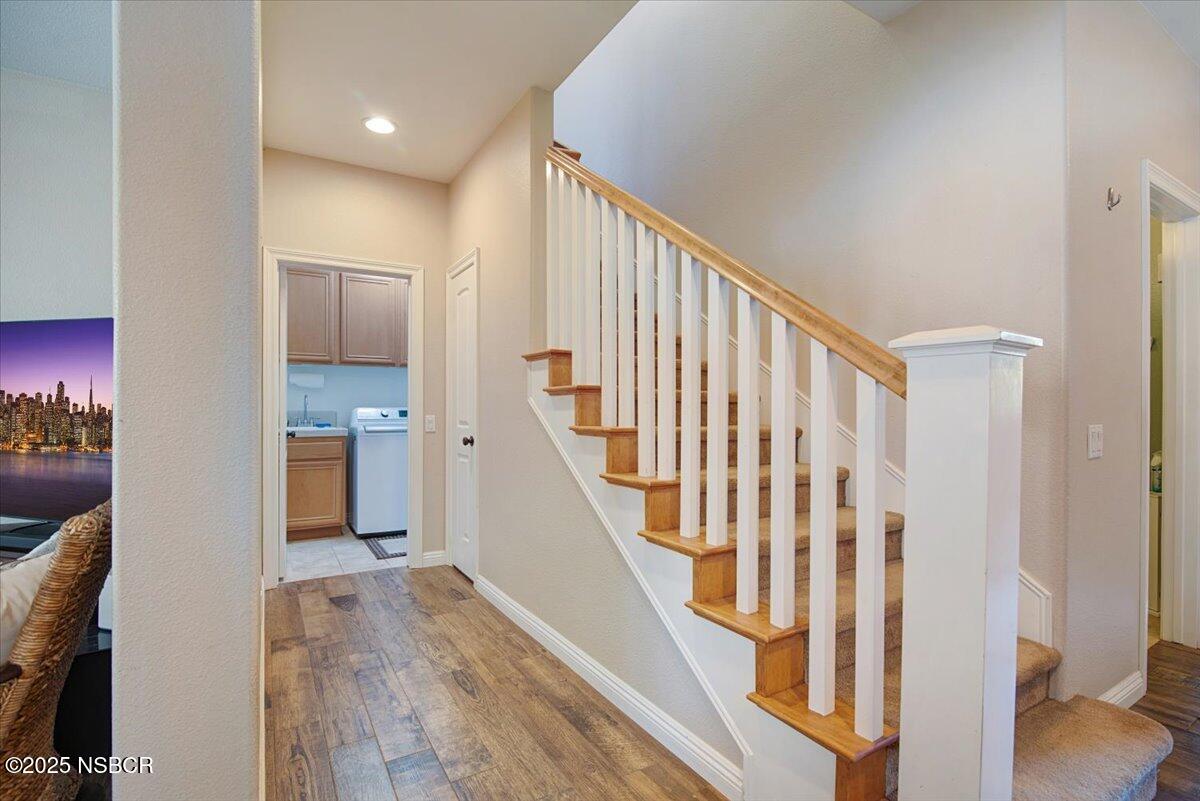 561 Andromeda Drive Lompoc, CA 93436 - Photo 32 of 54 a view of a hallway with wooden floor and entryway