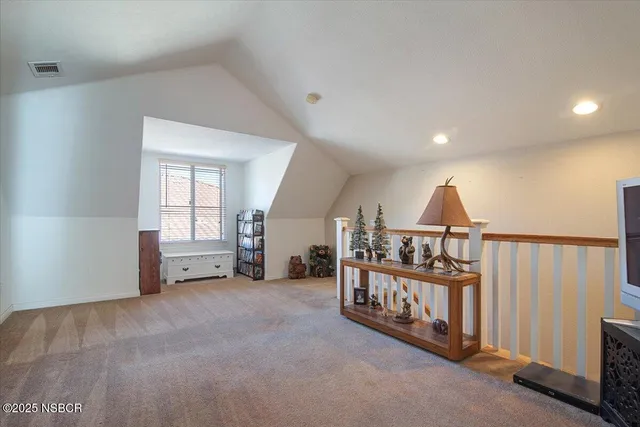 a bedroom with a bed and a dresser in it