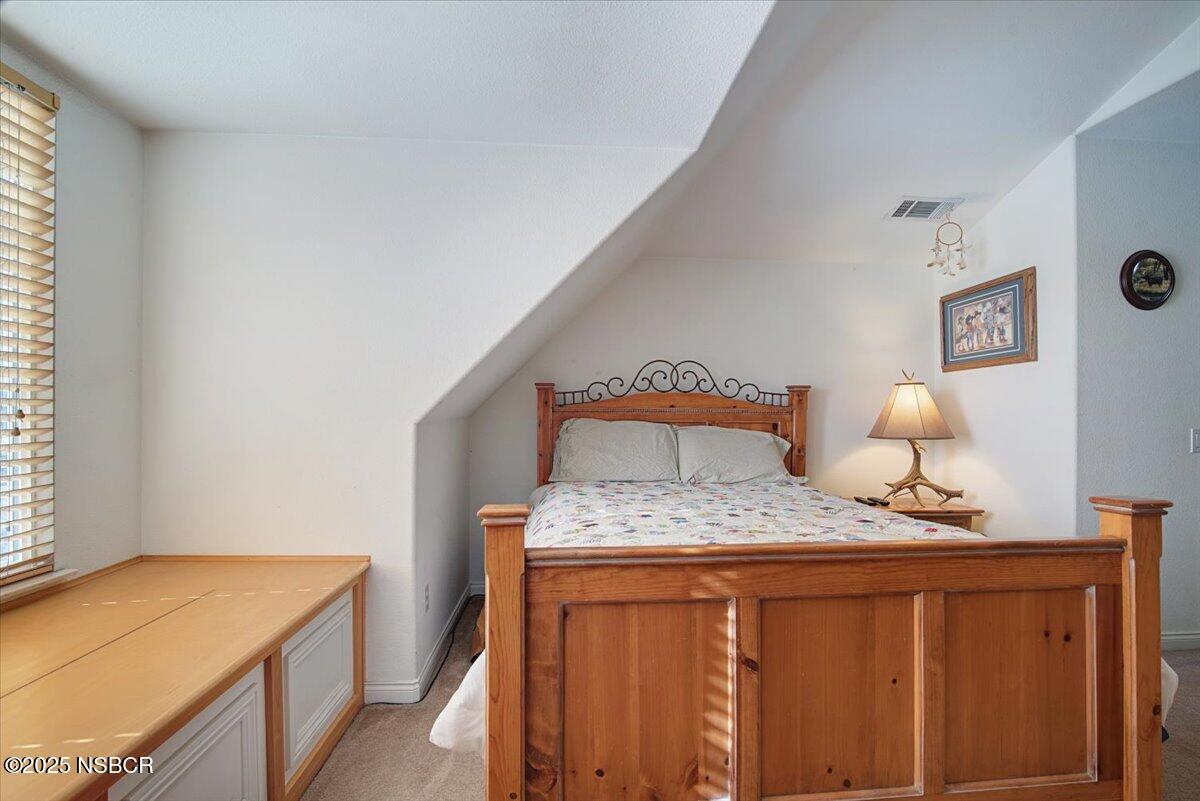 561 Andromeda Drive Lompoc, CA 93436 - Photo 41 of 54 a bedroom with a bed and a dresser