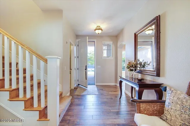 a living room with furniture fireplace and window