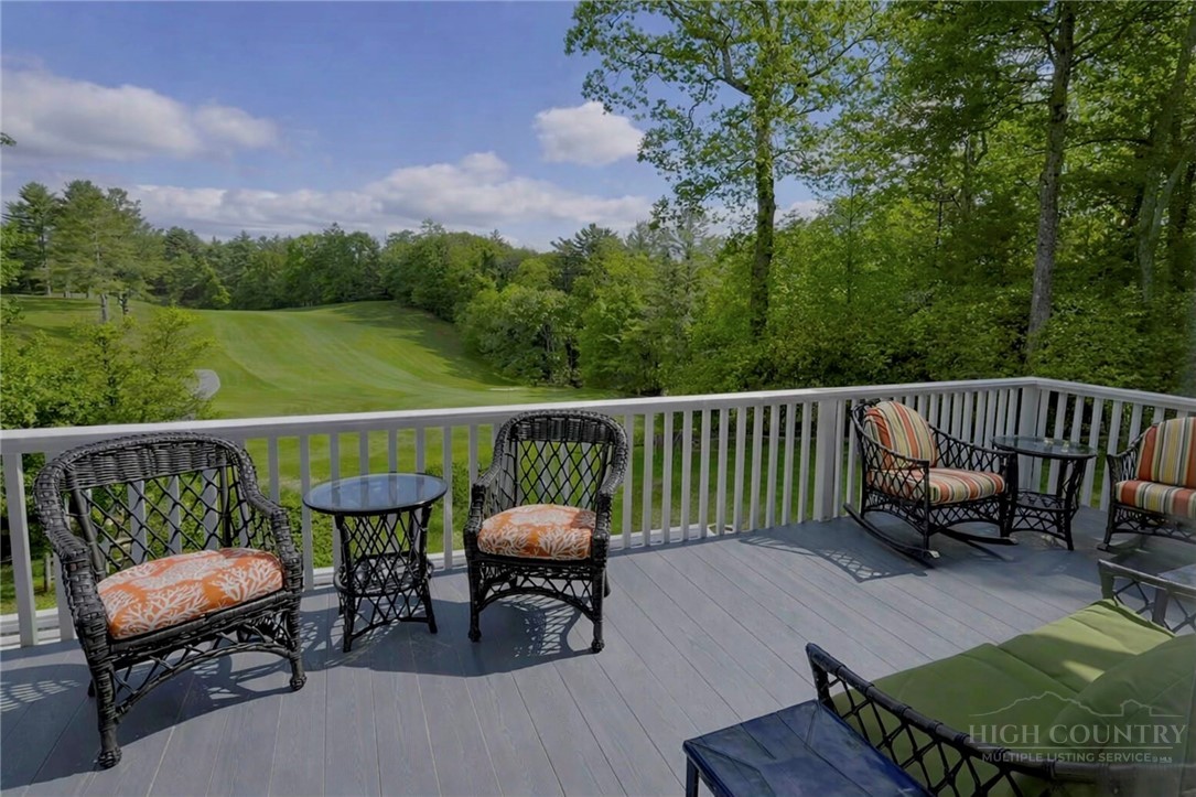 638 Ridge Road Glade Valley, NC 28627 - Photo 9 of 44 a view of a chair and table on the deck