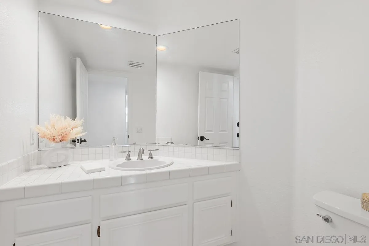 2016 Sequoia Street San Marcos, CA 92078 - Photo 21 of 50 a bathroom with a sink and a mirror