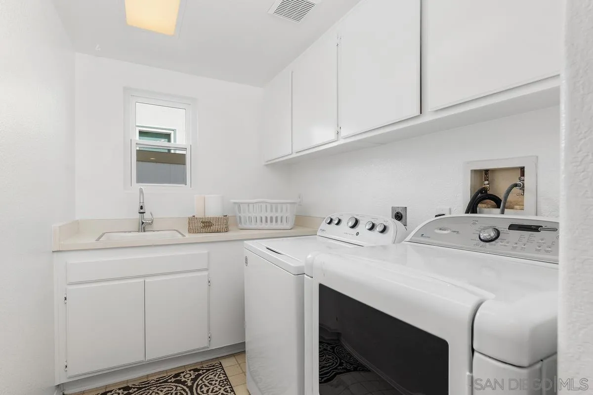 2016 Sequoia Street San Marcos, CA 92078 - Photo 22 of 50 a utility room with sink dryer and washer