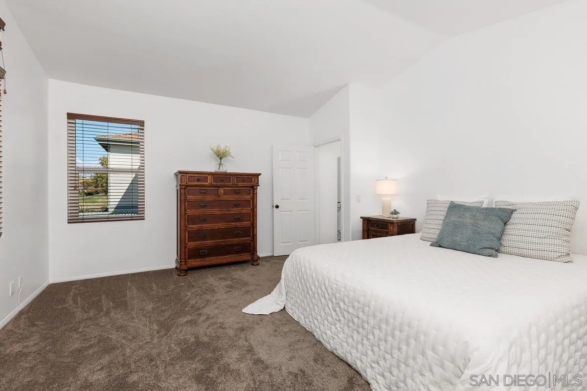 2016 Sequoia Street San Marcos, CA 92078 - Photo 26 of 50 a bedroom with a bed and a dresser