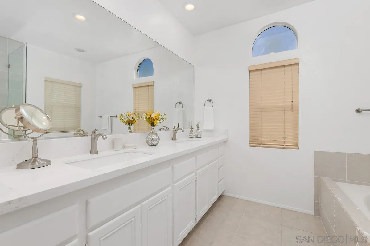 2016 Sequoia Street San Marcos, CA 92078 - Photo 27 of 50 a bathroom with a double vanity sink and a mirror