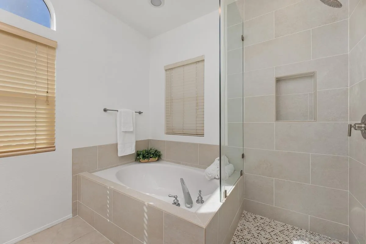 2016 Sequoia Street San Marcos, CA 92078 - Photo 28 of 50 a white bath tub sitting in a bathroom