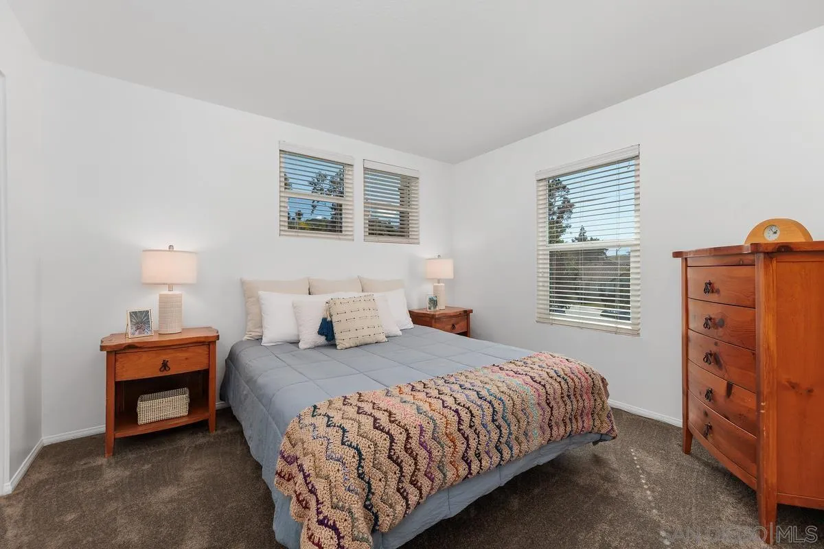 2016 Sequoia Street San Marcos, CA 92078 - Photo 29 of 50 a bedroom with a bed and a cabinets