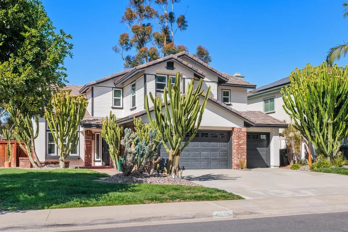 2016 Sequoia Street San Marcos, CA 92078 - Photo 4 of 50 a front view of a house with garden