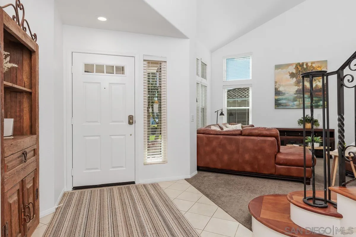 2016 Sequoia Street San Marcos, CA 92078 - Photo 9 of 50 a living room with furniture and a fireplace