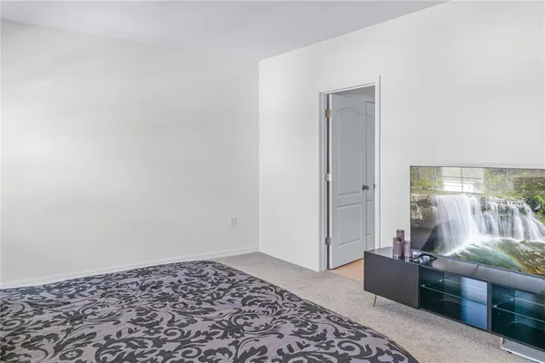 a bathroom with a granite countertop sink and a shower