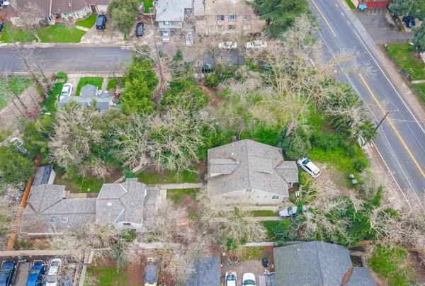 an aerial view of a house with a swimming pool yard and outdoor seating