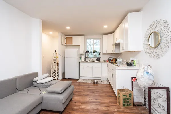 a kitchen with cabinets and window