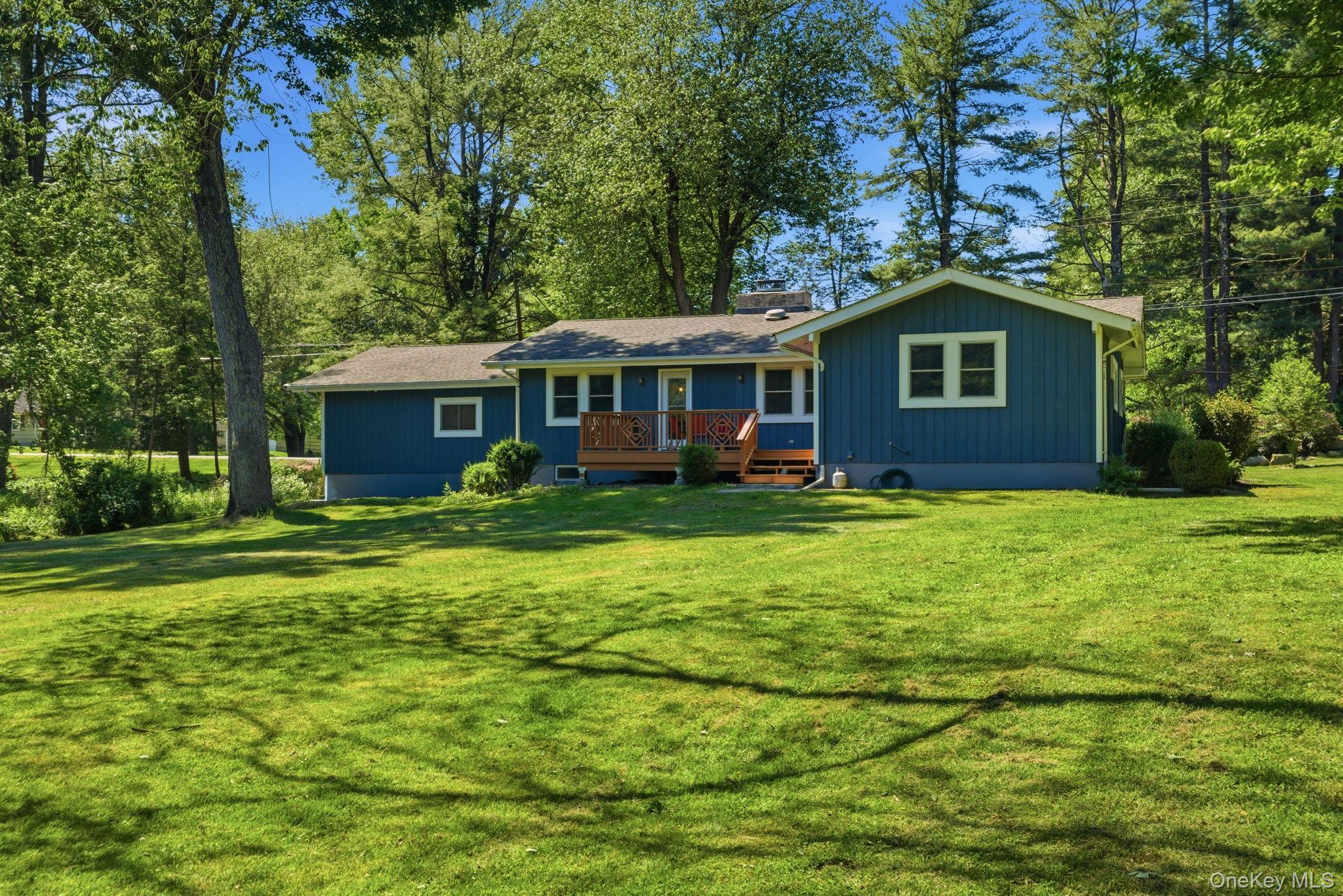 35 Deans Bridge Road Somers, NY 10589 - Photo 32 of 49 The freshly painted ranch shows off its clean single-level profile from the back.