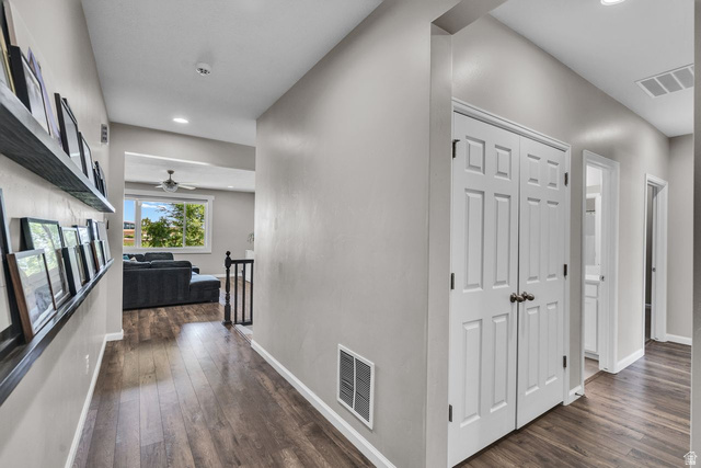 3269 West 650 North Layton, UT 84041 - Photo 6 of 35 Hallway featuring wood-finish flooring, light grey wall paint, and white trim