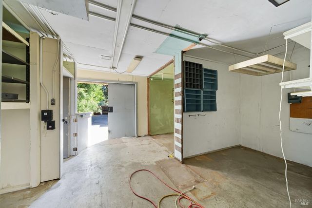 a kitchen with cabinets and window