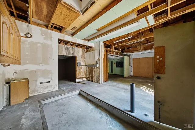 a front view of house with yard and trees around