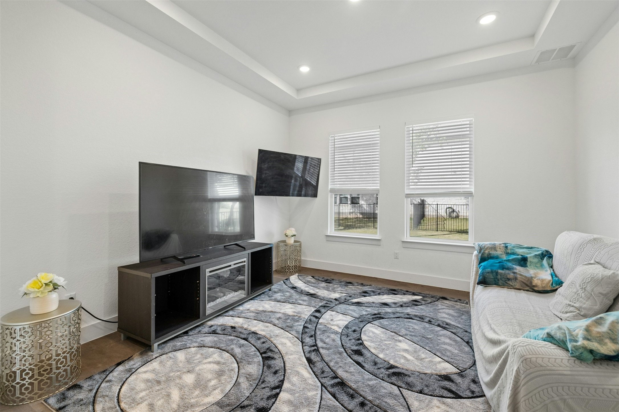 172 Shady Hl Loop Liberty Hill, TX 78642 - Photo 11 of 30 a living room with furniture and a flat screen tv