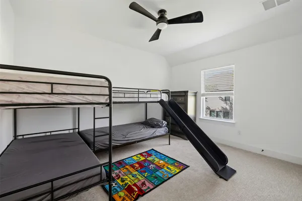 a bedroom with bunk bed