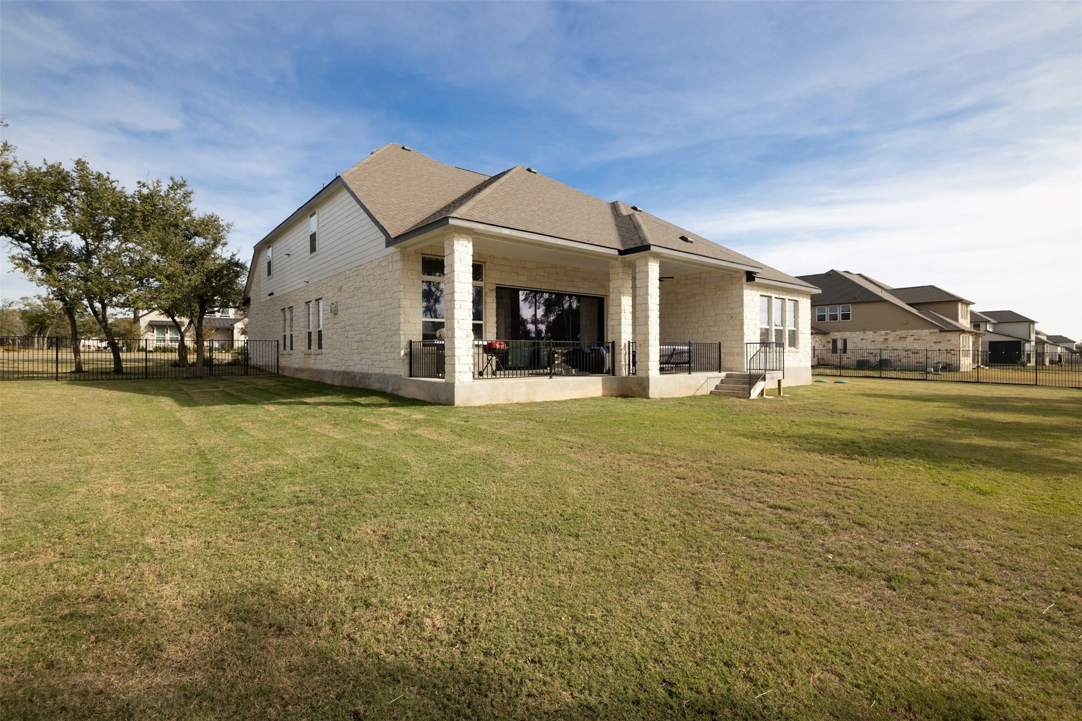 172 Shady Hl Loop Liberty Hill, TX 78642 - Photo 27 of 30 a view of a house with a big yard and large trees