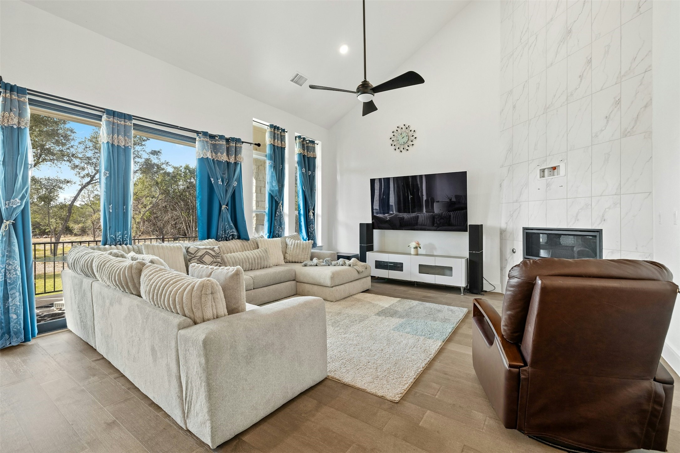 172 Shady Hl Loop Liberty Hill, TX 78642 - Photo 6 of 30 a living room with furniture and a flat screen tv