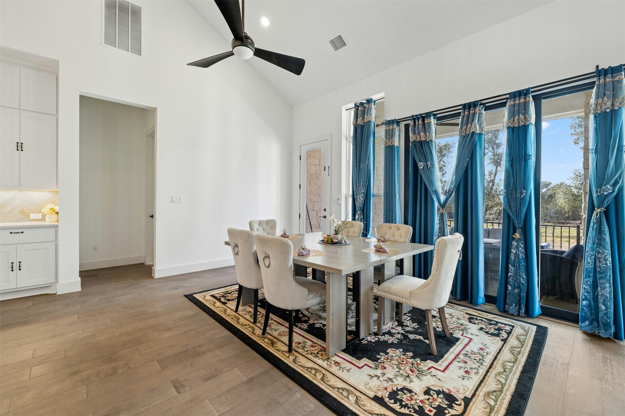 172 Shady Hl Loop Liberty Hill, TX 78642 - Photo 8 of 30 a view of a dining room with furniture window and wooden floor